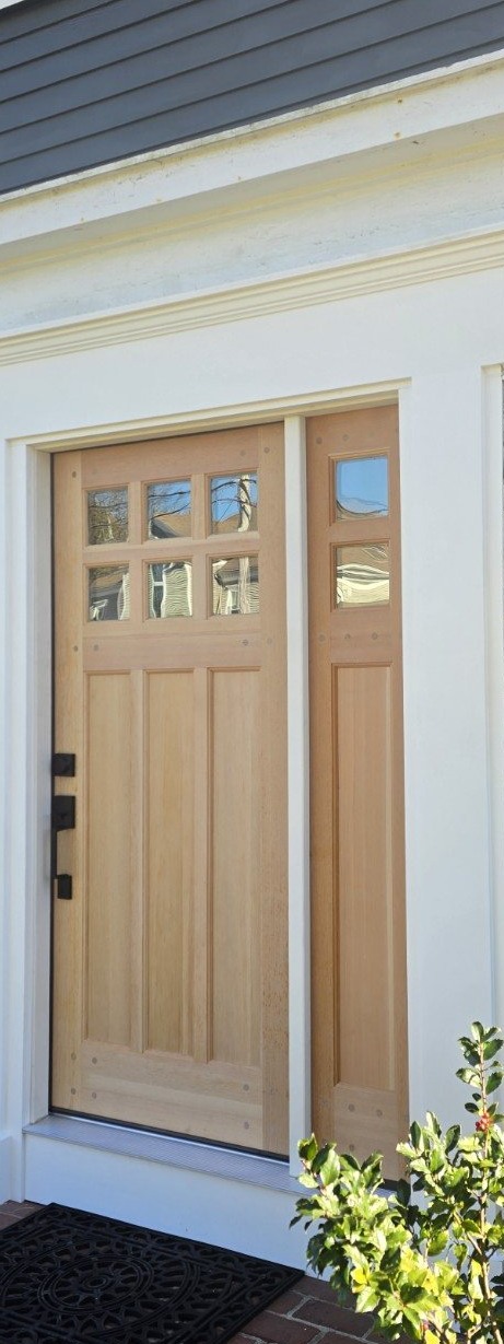Natural wood exterior door installation